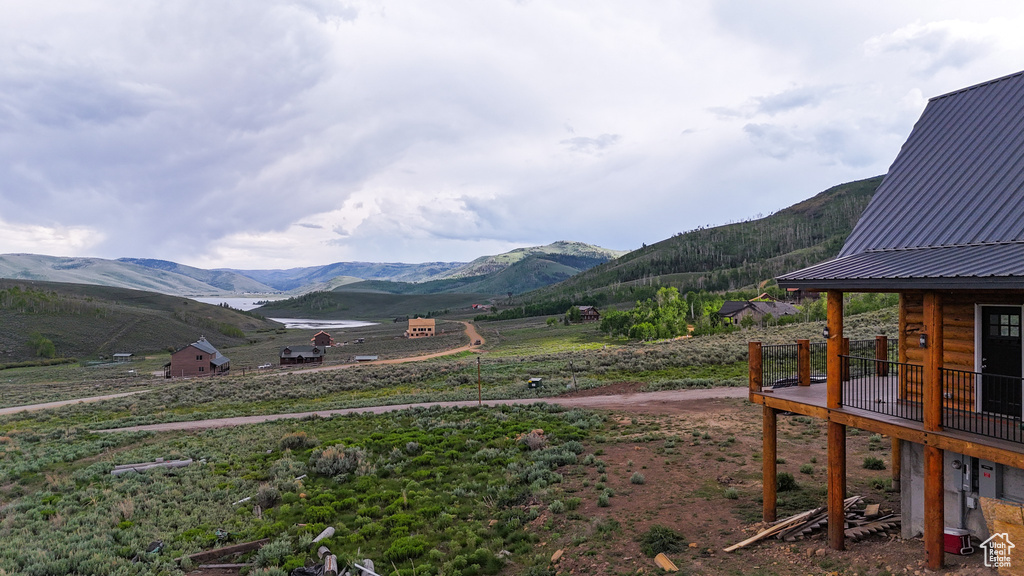 View of mountain backdrop with rural landscape