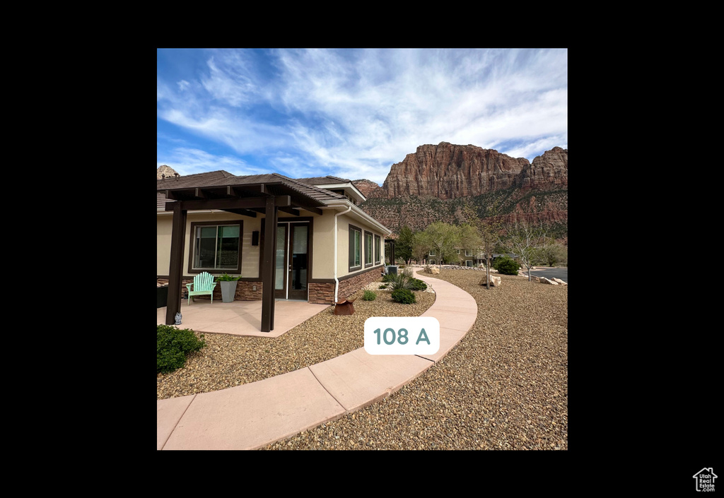 View of patio featuring a mountain view and a pergola
