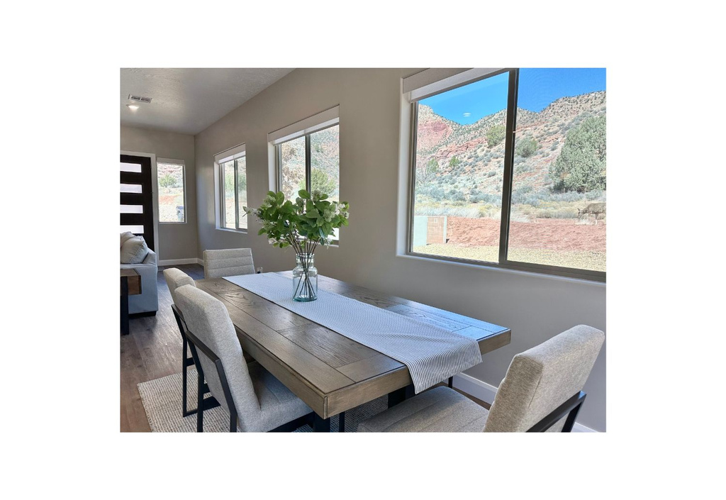 Dining room with baseboards and wood finished floors