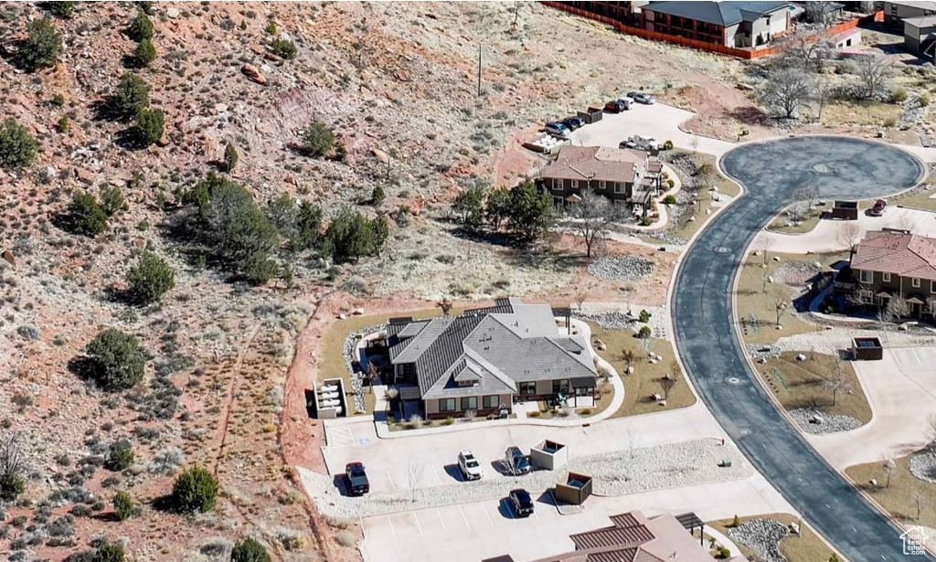 Aerial view of property and surrounding area featuring a desert landscape