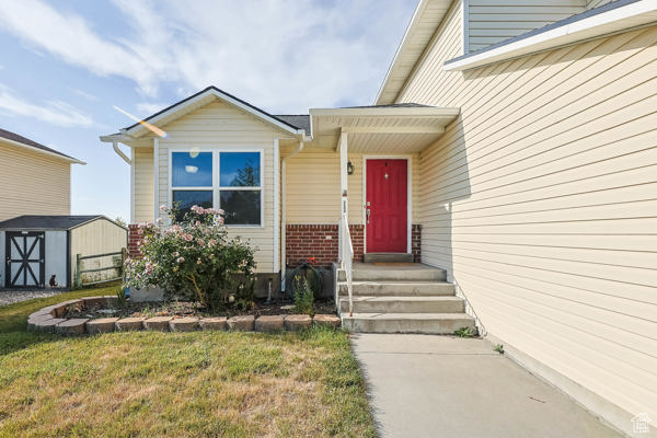Property entrance featuring a lawn