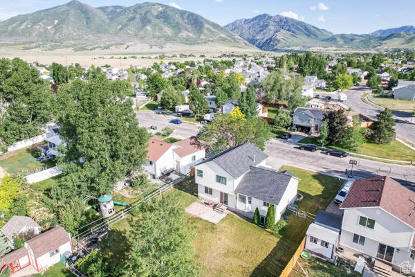 Aerial perspective of suburban area with a mountainous background