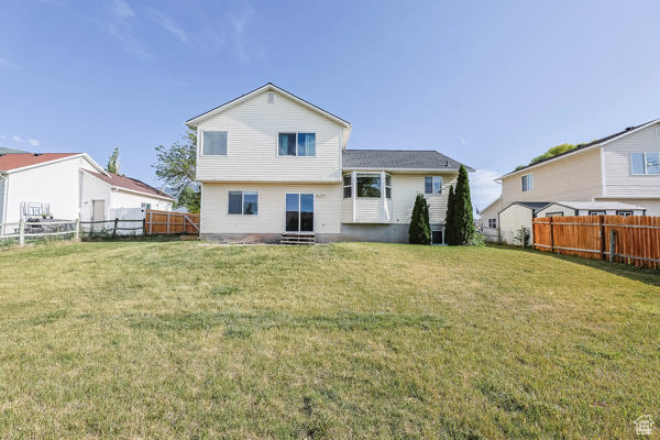 Rear view of property with entry steps