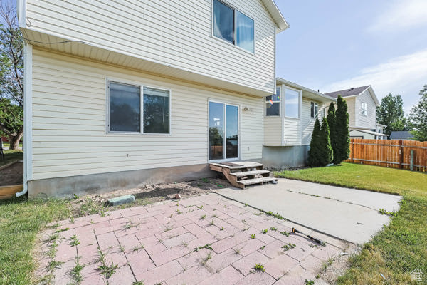 Back of property with a patio area