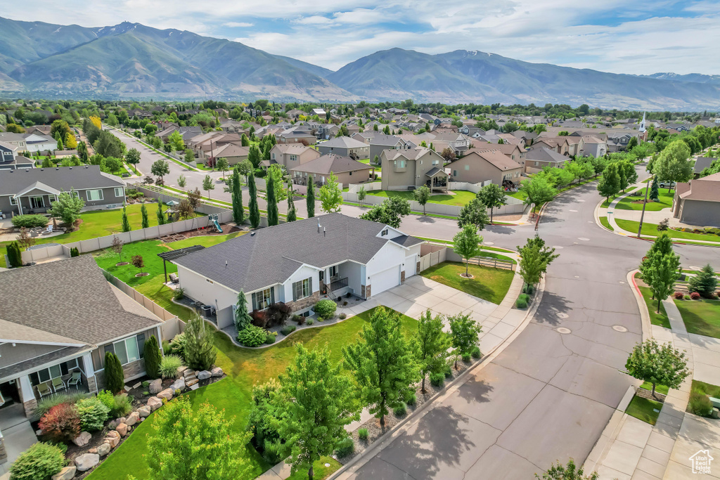 Aerial perspective of suburban area with a mountain backdrop