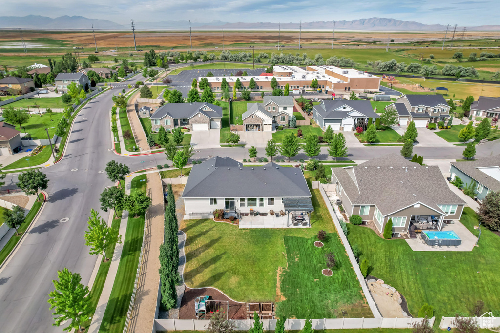 Aerial view of residential area featuring mountains