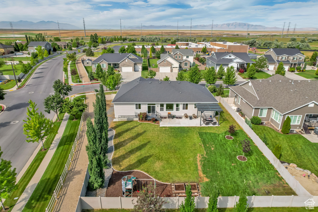 Aerial view of residential area with a mountainous background
