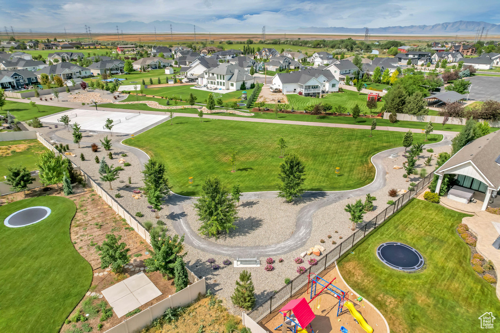 Aerial perspective of suburban area with a mountainous background