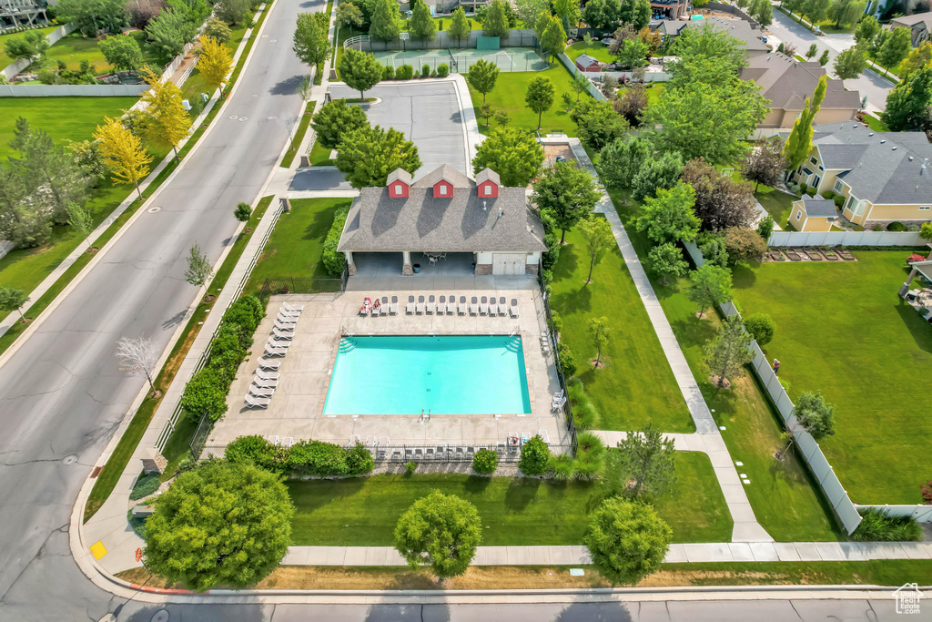 Aerial perspective of suburban area with a pool