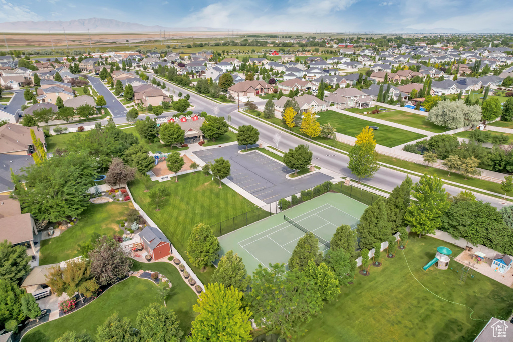 Aerial view of property\\\'s location featuring nearby suburban area and a mountainous background