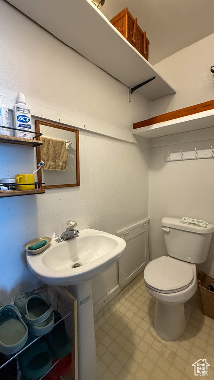 Bathroom featuring toilet and a sink