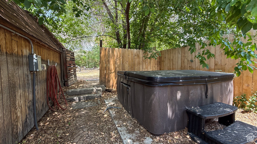 View of yard with a hot tub