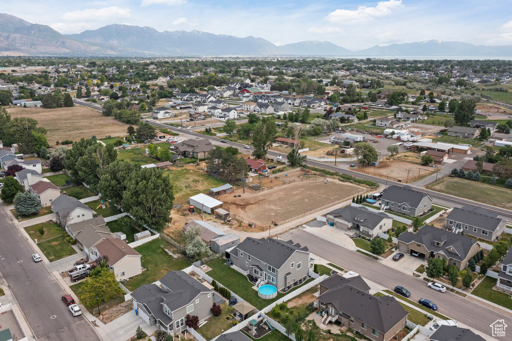 Aerial perspective of suburban area featuring a mountainous background