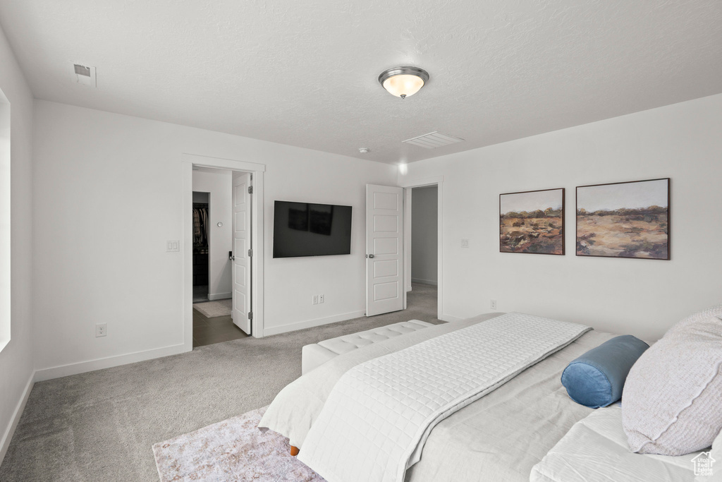 Carpeted bedroom with baseboards