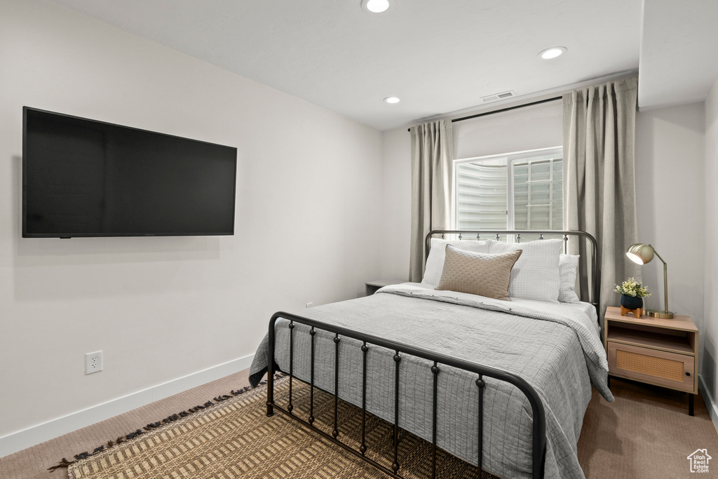 Bedroom with carpet floors, recessed lighting, and baseboards