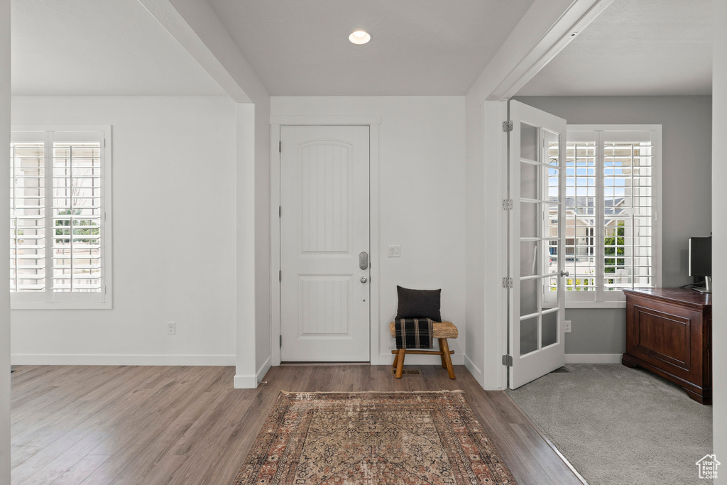 Entrance foyer featuring light wood-style floors, baseboards, and recessed lighting