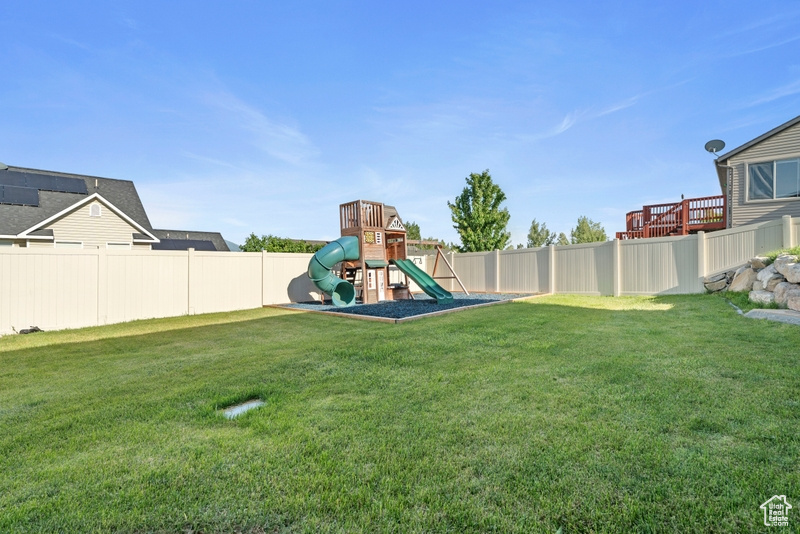 View of yard featuring a playground