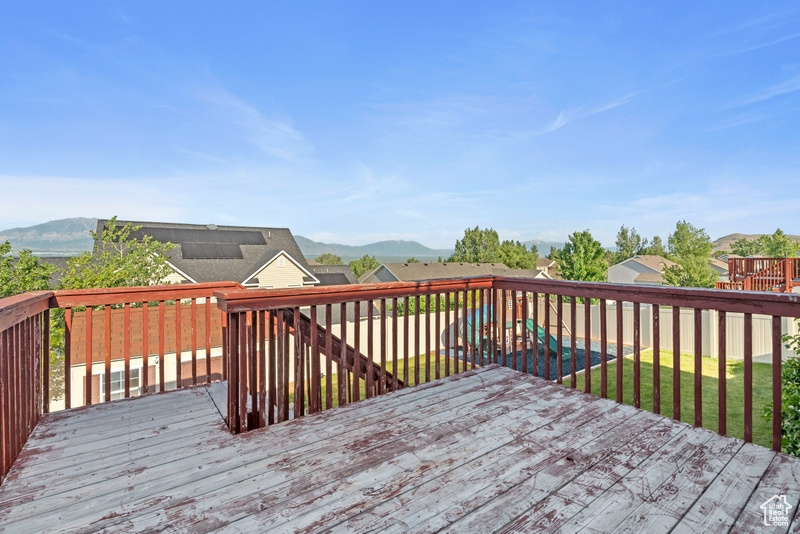 Wooden deck featuring a mountain view