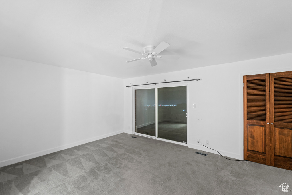 Interior space featuring a ceiling fan and baseboards