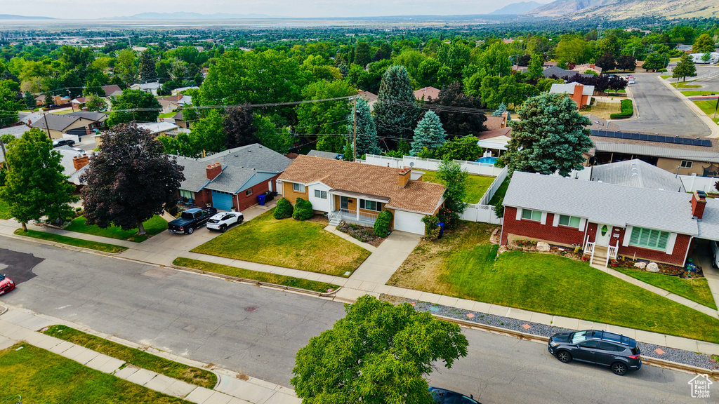 Aerial perspective of suburban area with a mountain backdrop