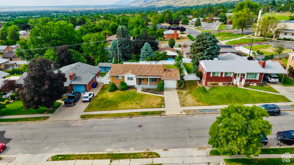 Aerial perspective of suburban area with a mountain backdrop