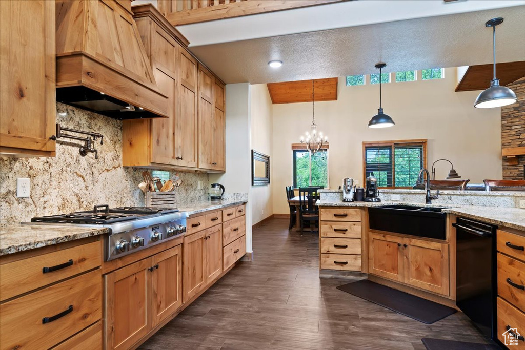 Kitchen with custom range hood, a sink, black dishwasher, stainless steel gas stovetop, and tasteful backsplash