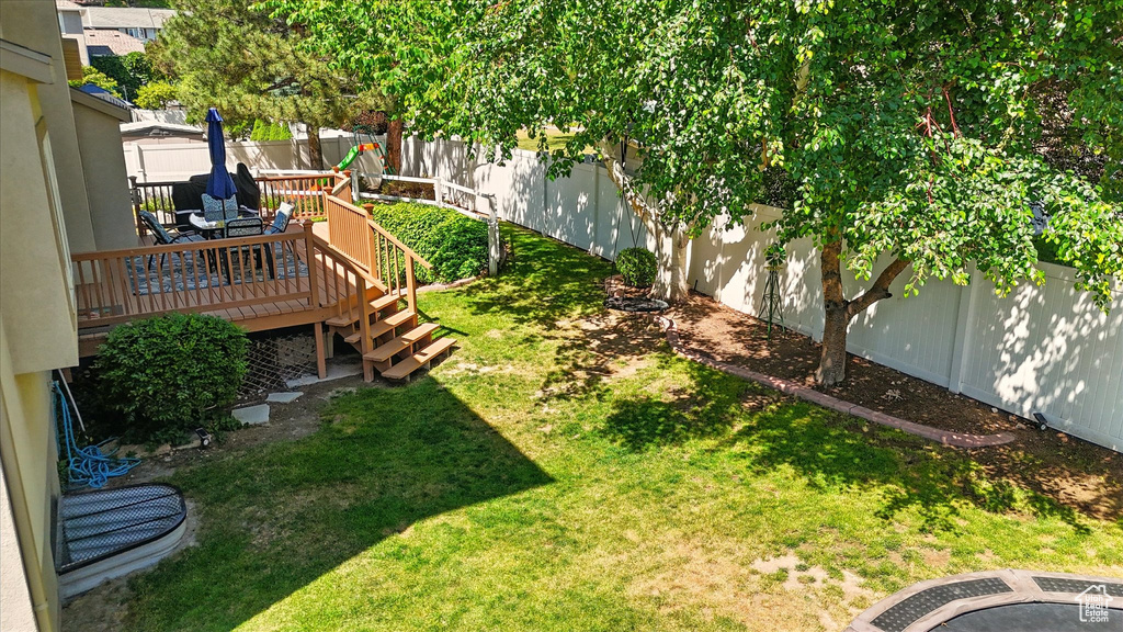 View of yard with a deck