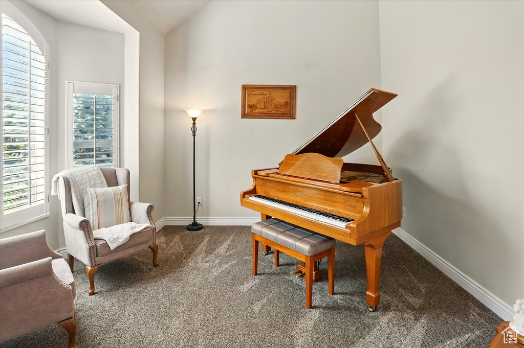 Sitting room with carpet floors and baseboards