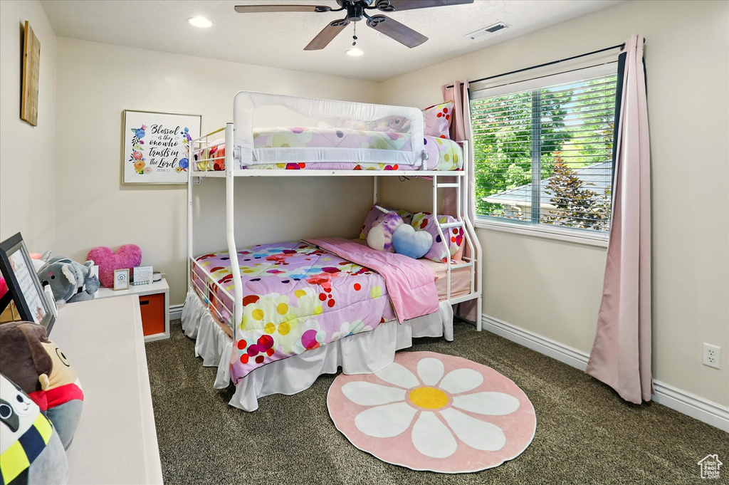 Carpeted bedroom with baseboards, recessed lighting, and a ceiling fan