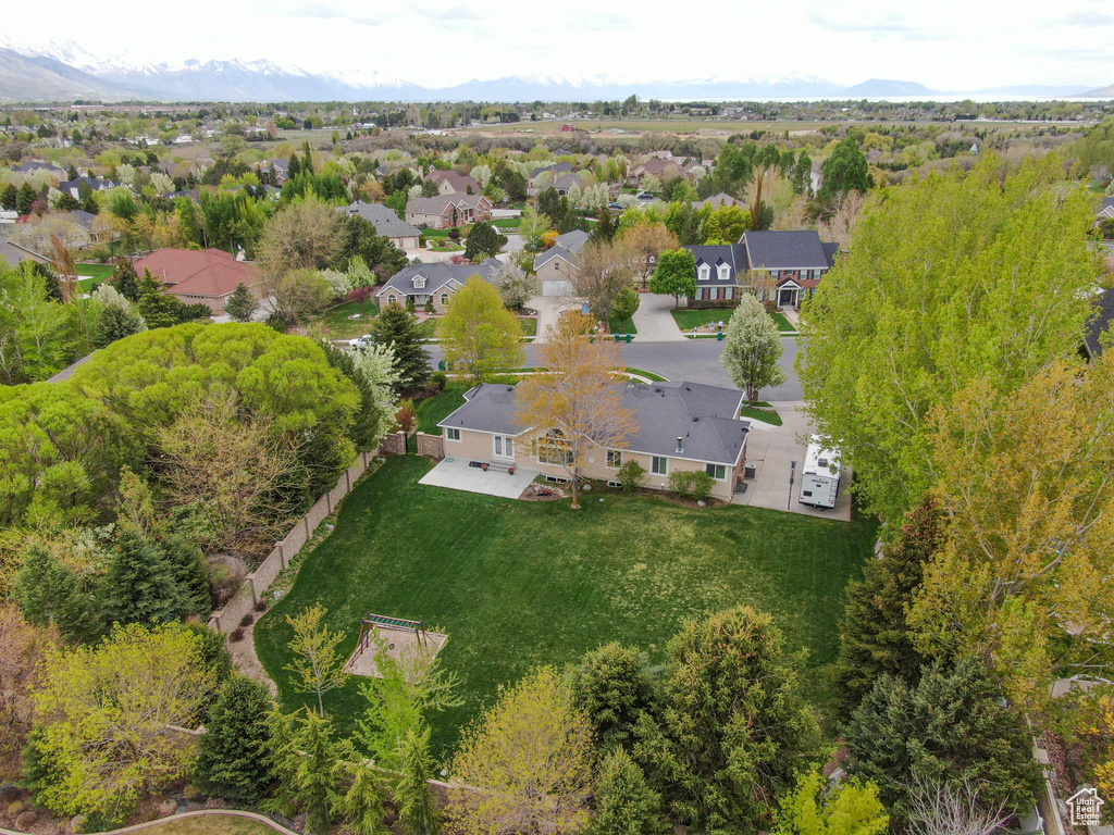 Aerial view of residential area featuring mountains