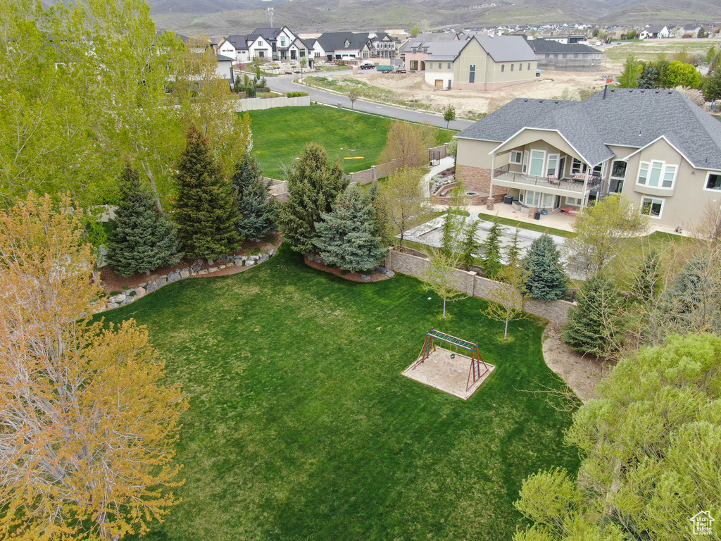 Aerial perspective of suburban area featuring a mountain backdrop