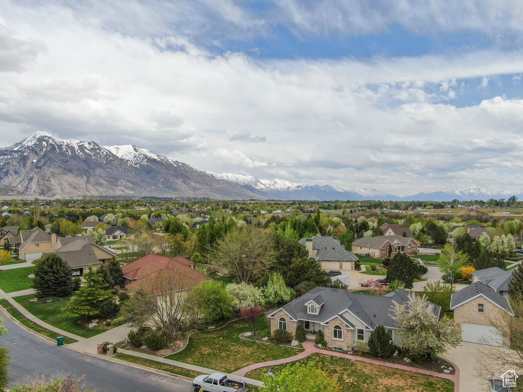 Aerial view of residential area featuring a mountainous background
