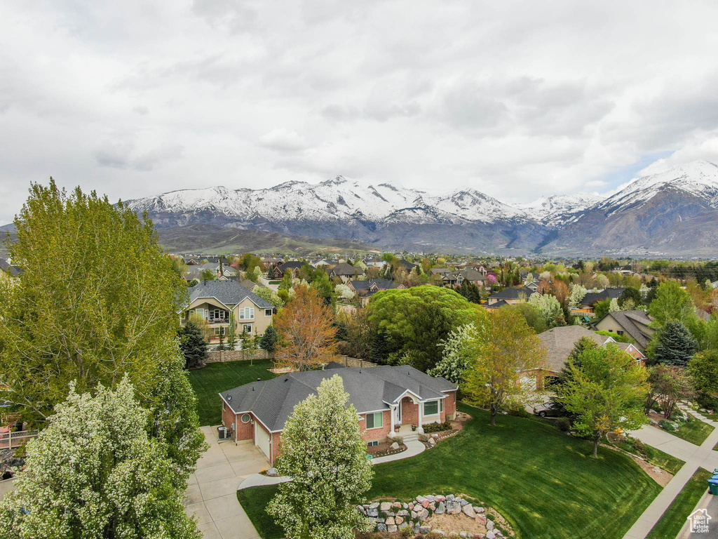 Aerial view of residential area featuring mountains