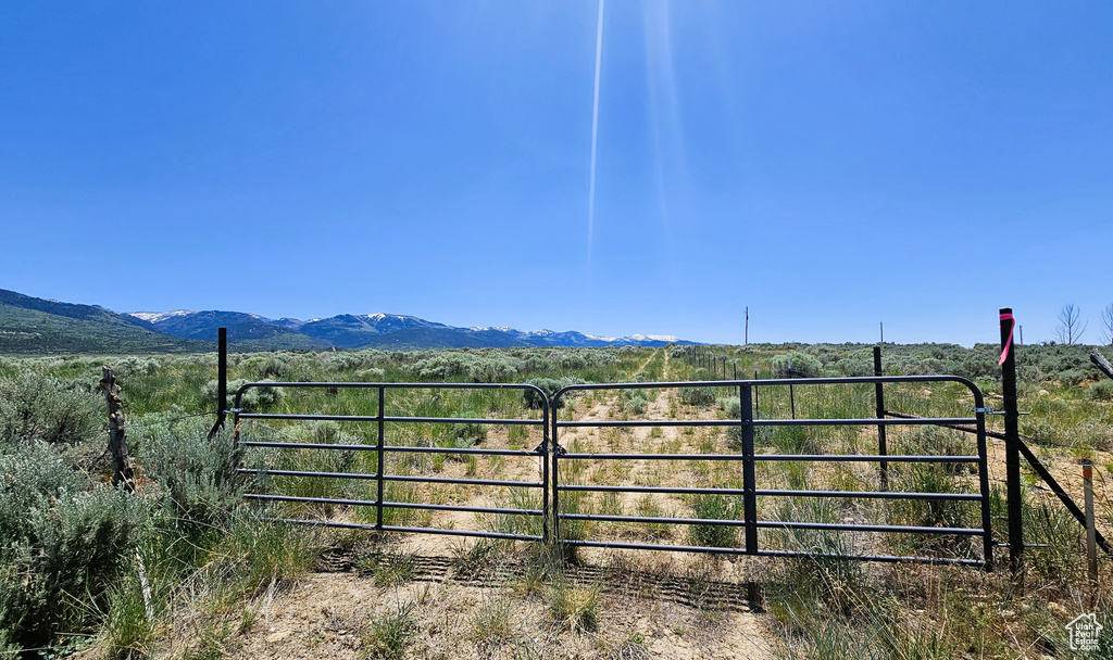 Gate featuring a view of countryside and a mountain view