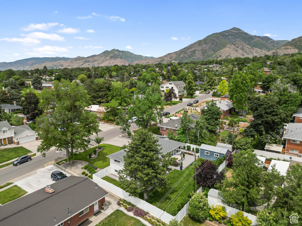 Aerial view of residential area featuring a mountainous background