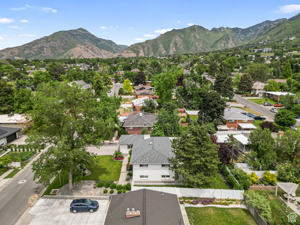 Aerial perspective of suburban area with a mountain backdrop