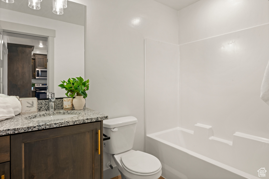 Bathroom with vanity and shower / bath combination