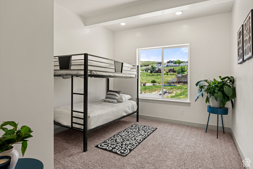 Carpeted bedroom featuring baseboards and recessed lighting