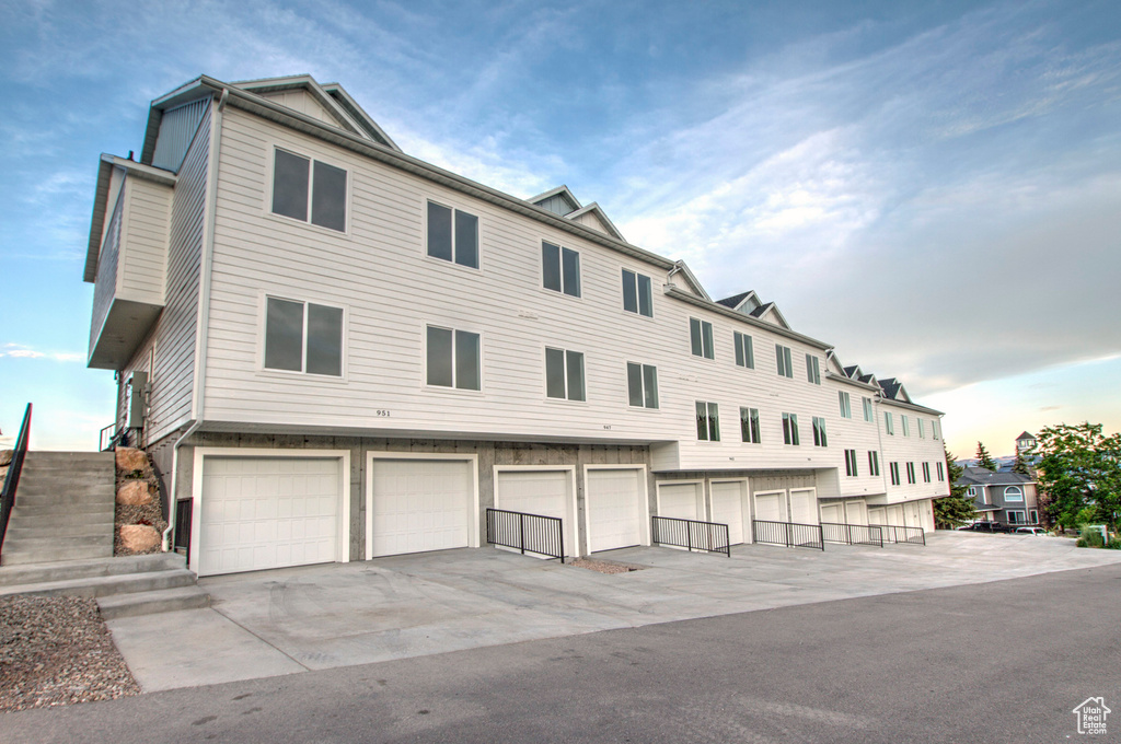 View of building exterior featuring an attached garage