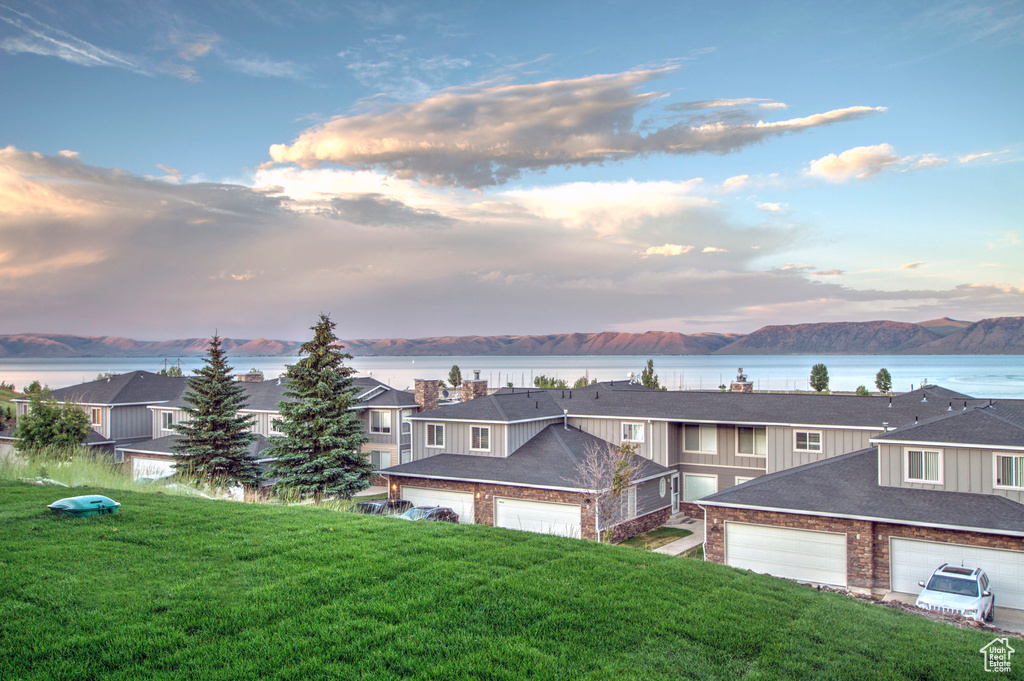 Water view with mountains and nearby suburban area