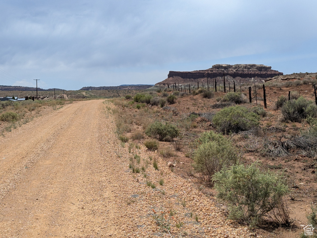 View of dirt / gravel road with a view of countryside