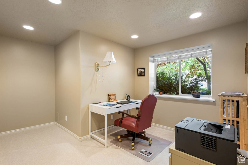 Carpeted office space featuring recessed lighting and baseboards