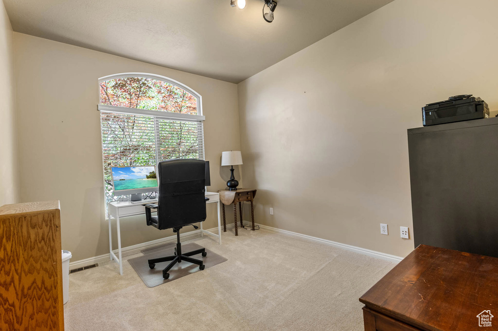 Office area with carpet and baseboards