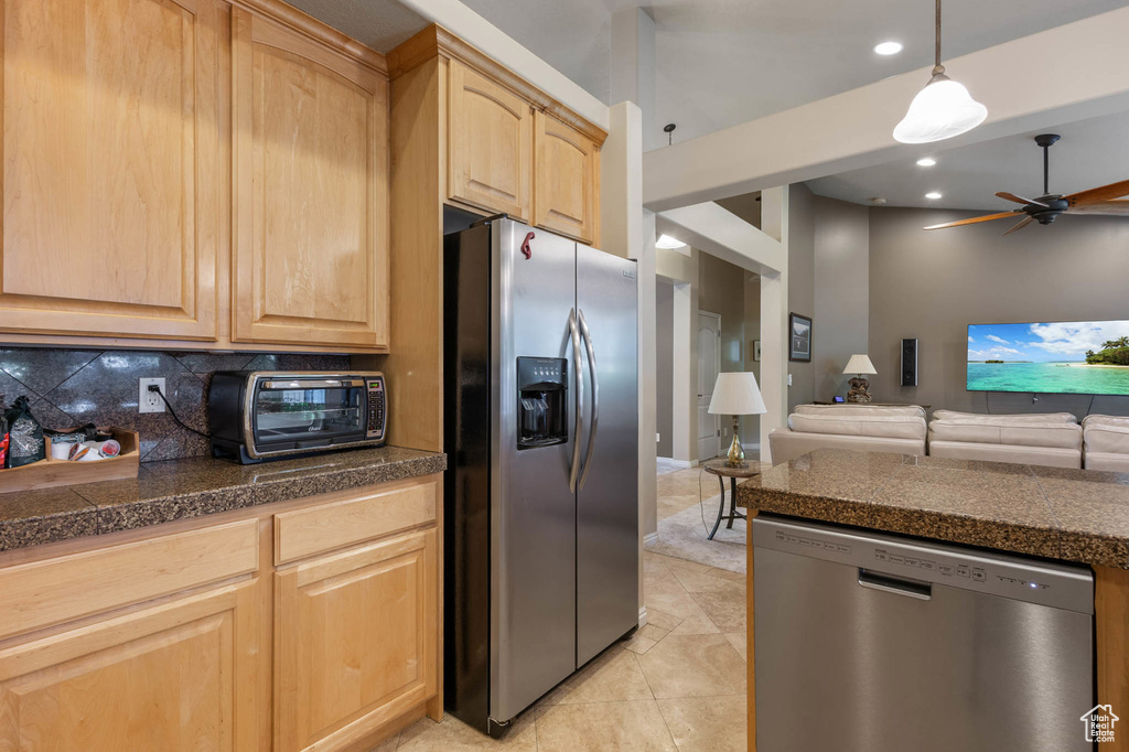 Kitchen with appliances with stainless steel finishes, light brown cabinetry, tile counters, a ceiling fan, and recessed lighting