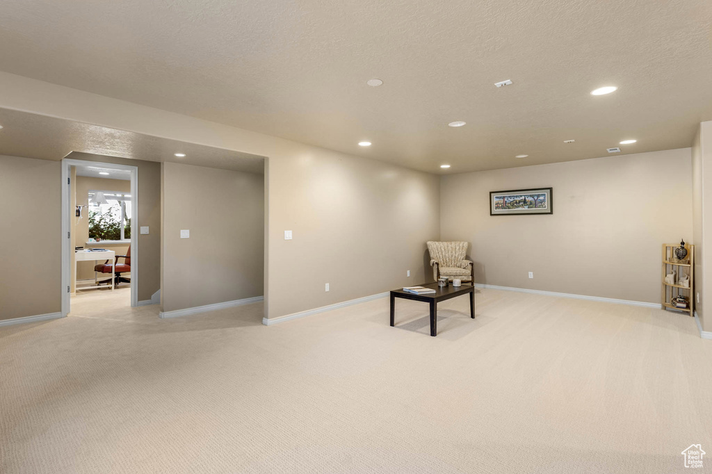 Unfurnished room with recessed lighting, light colored carpet, and baseboards