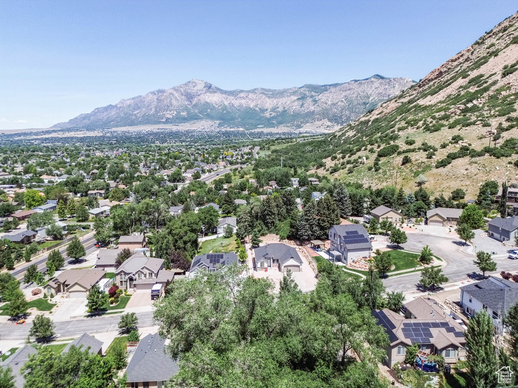 Aerial view of residential area featuring a mountainous background