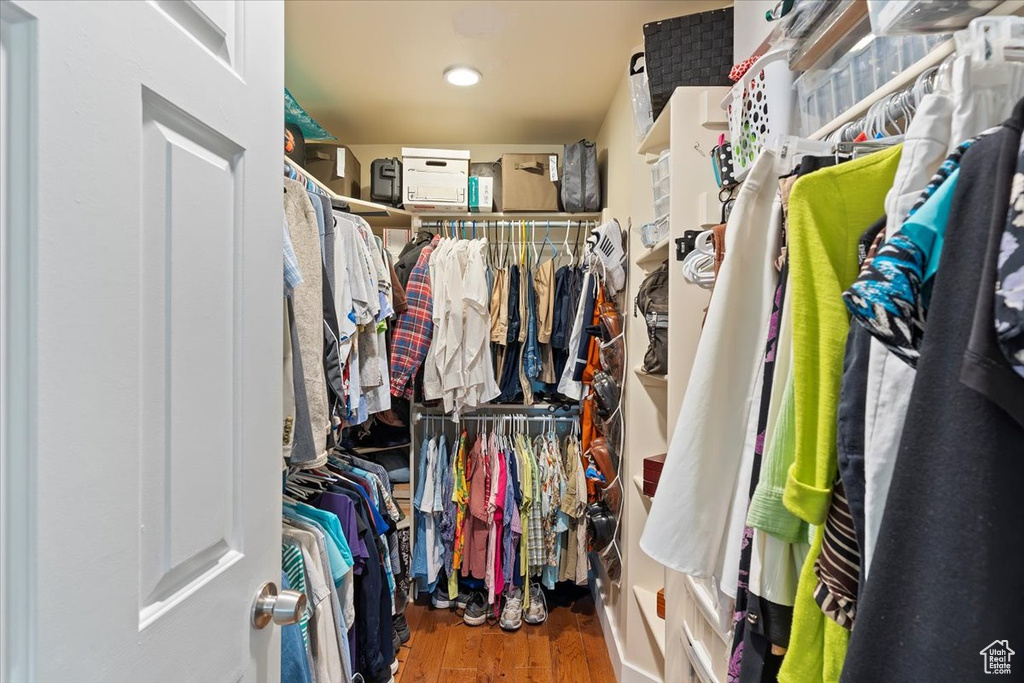Spacious closet featuring wood finished floors