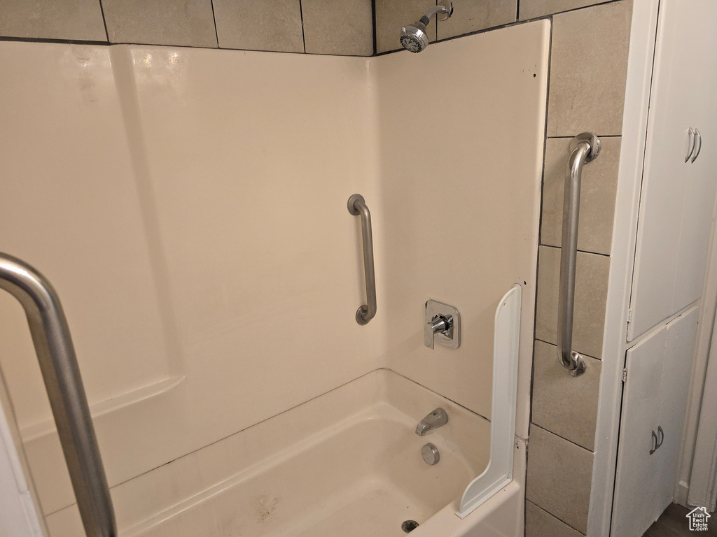 Full bathroom with shower / tub combination