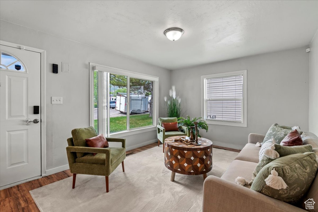 Living area featuring light wood-style flooring and baseboards