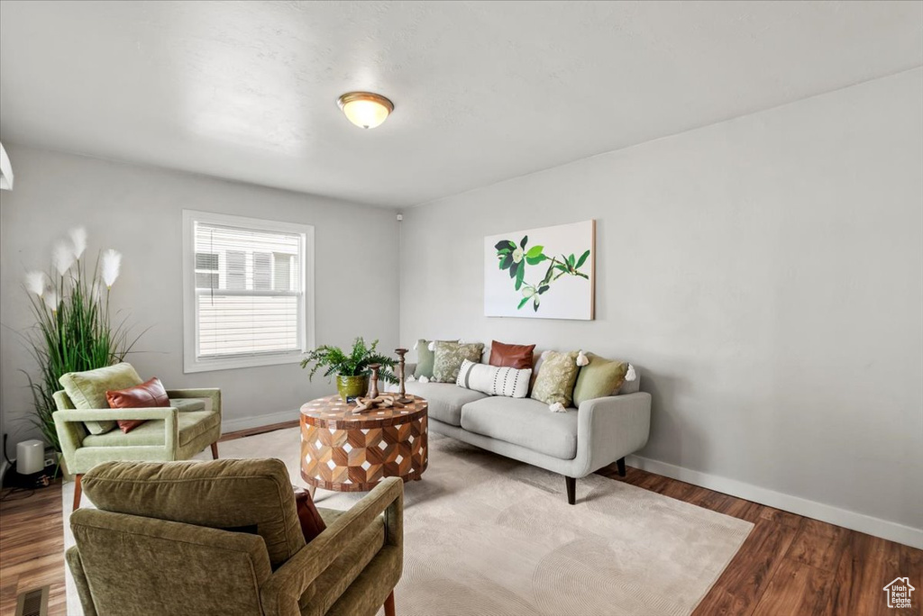 Living room with baseboards and wood finished floors